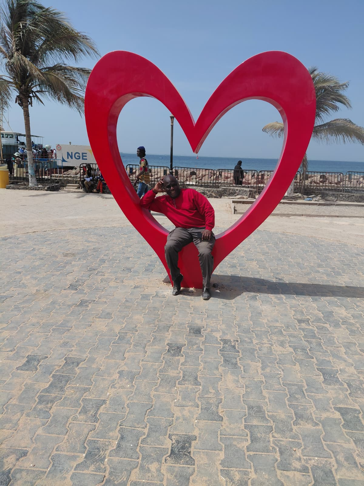 Dr. Ndi at the heart monument, Gorée Island, Senegal